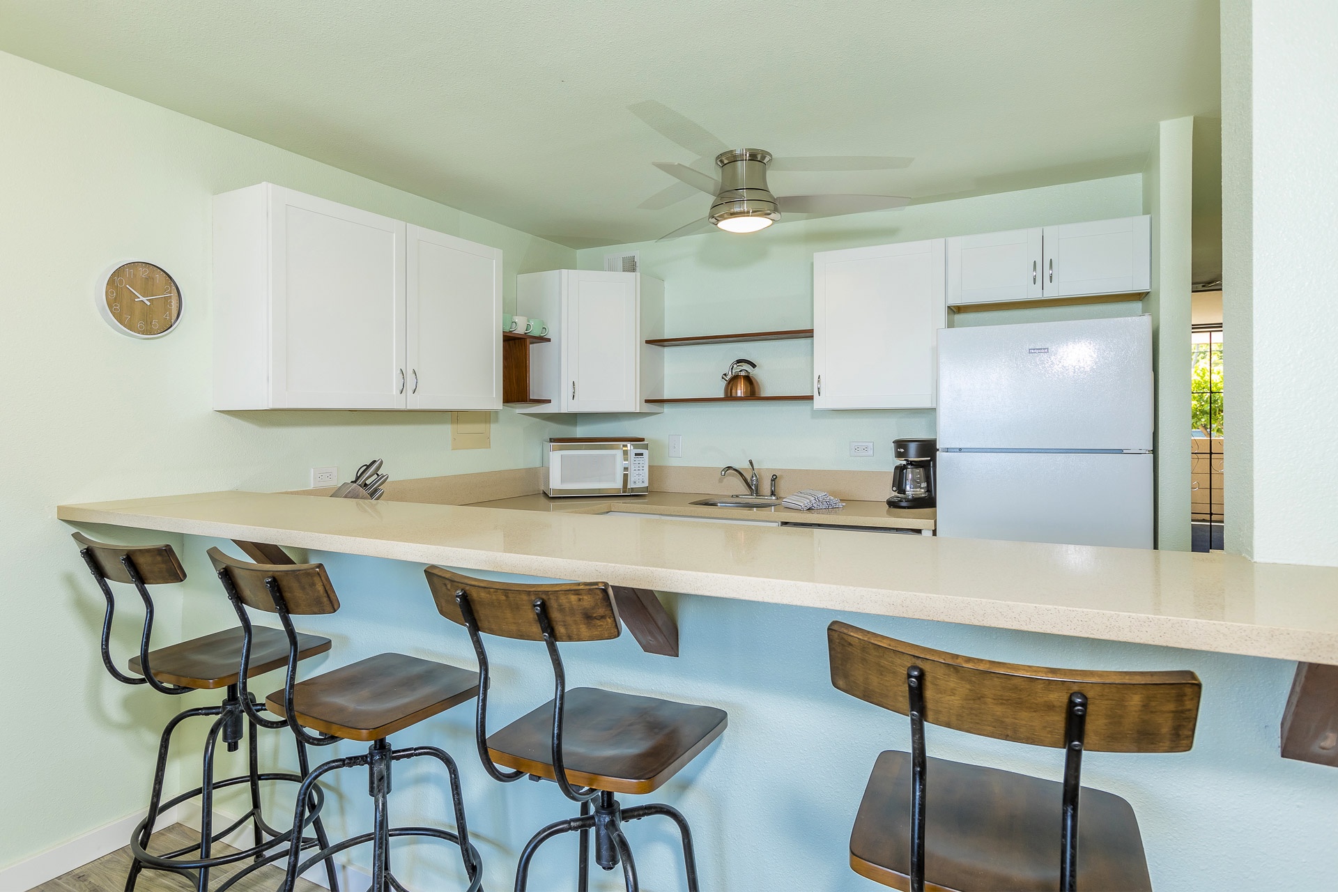 Gather around the spacious breakfast bar in your bright, fully-equipped kitchen. With plenty of counter space and all the appliances you need, you'll feel right at home whipping up meals during your stay.