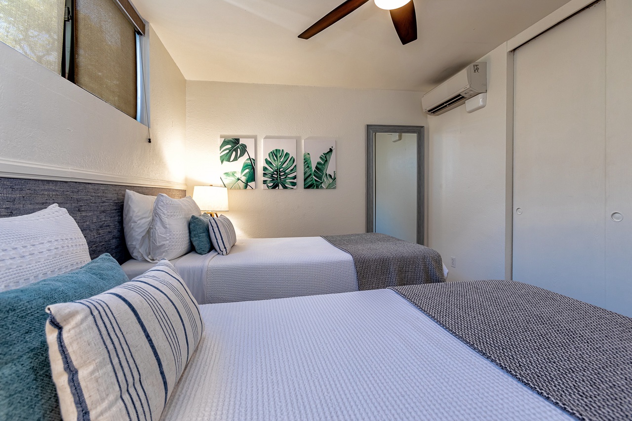 Plush guest bedroom with AC for a good night of rejuvenating.