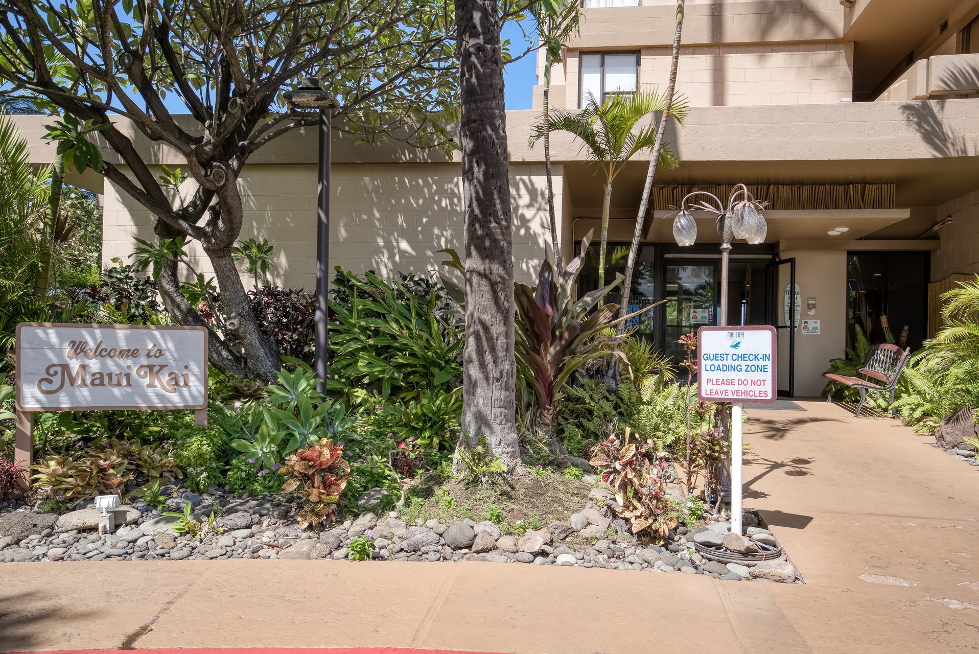 The property welcomes you with lush tropical landscaping.
