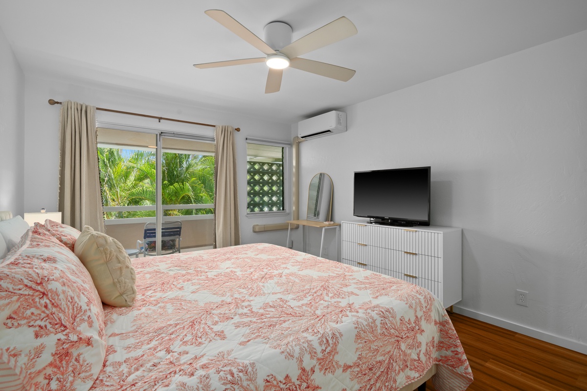 Your restful retreat awaits with a plush king bed, tropical garden views, ceiling fan, AC, flat-screen TV, perfect for unwinding after a day of adventure.
