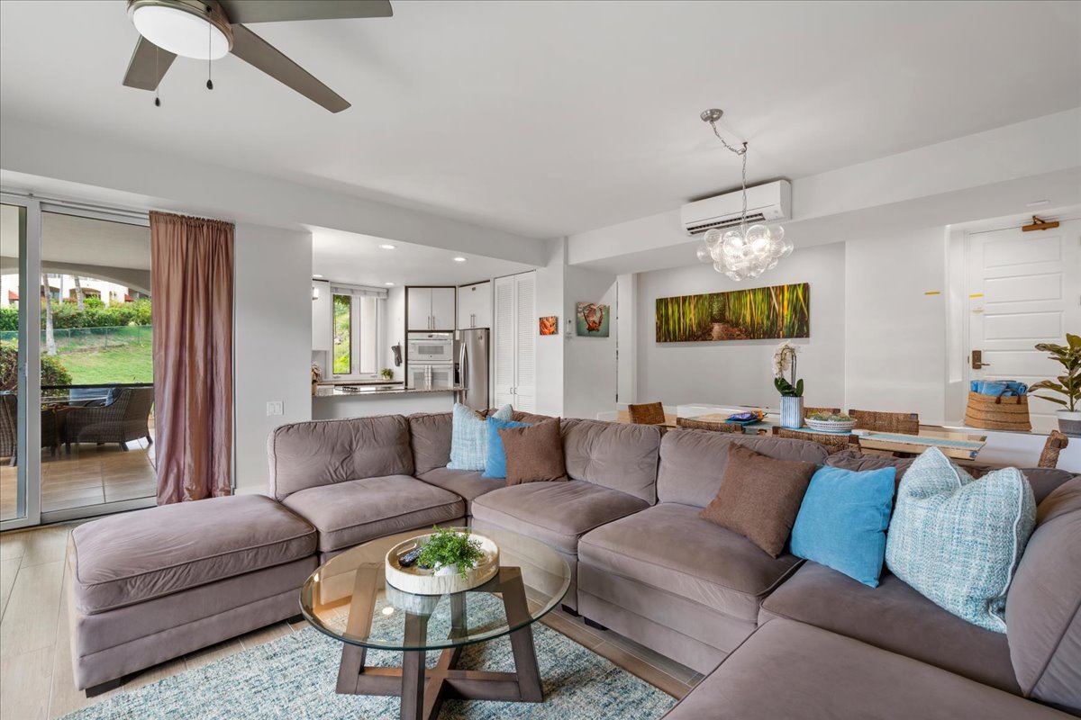 Sink into plush comfort in this bright, open living space where you can unwind after your island adventures. The ceiling fan keeps you cool while natural light fills the room through patio doors that open to your outdoor retreat.