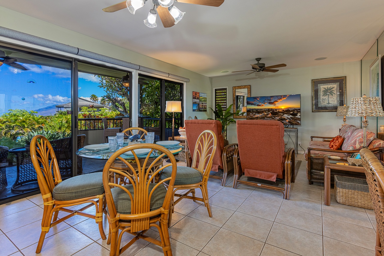 Picture yourself sipping morning coffee at this inviting dining table as tropical breezes drift through your open lanai, bringing the lush Hawaiian scenery right to you.