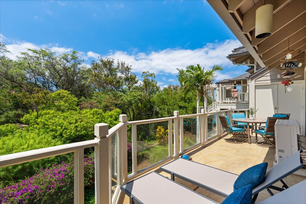 Your private balcony overlooks lush tropical gardens and vibrant bougainvillea, offering a serene spot to sip morning coffee, bask in the Hawaiian sun, or unwind with the gentle island breeze.
