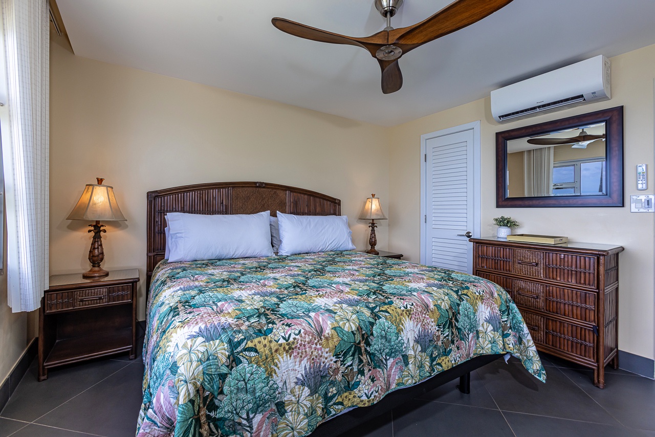 AC and ceiling fan to keep you cool in the primary bedroom
