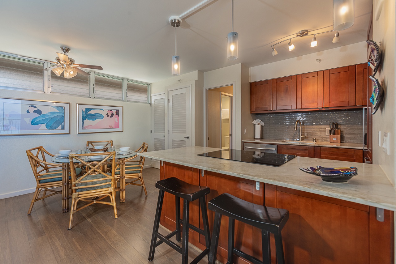Modern kitchen flows seamlessly into the dining area, perfect for cooking together and sharing meals