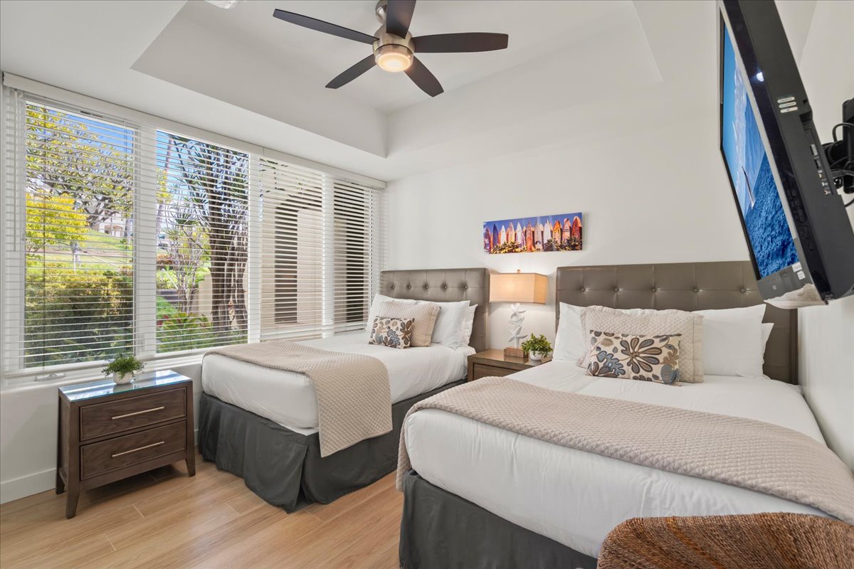 Guest bedroom with two double beds perfect for family or friends