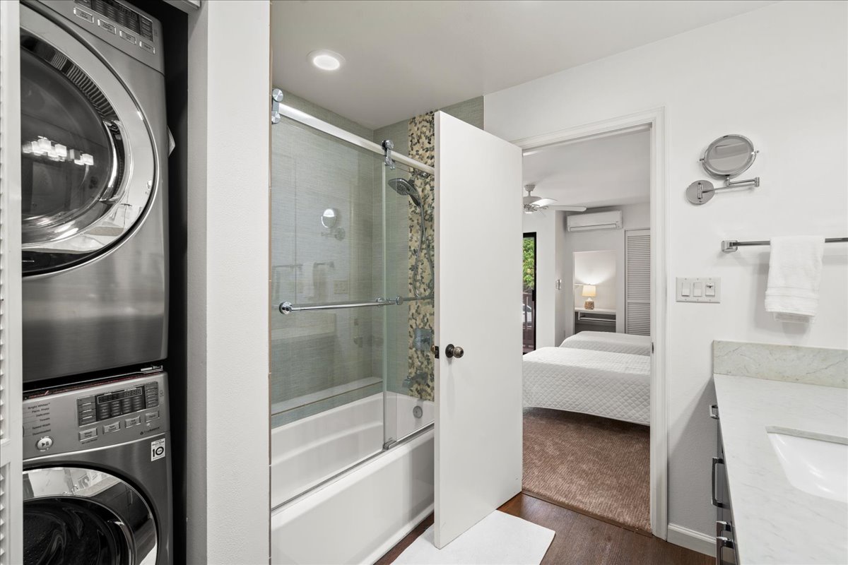 Both tub and shower provided in this lovely guest bathroom.