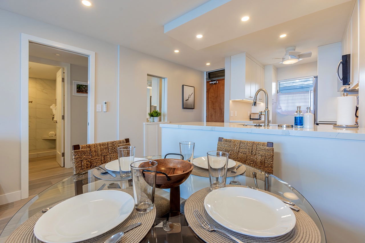 Bright dining space with seating for four guests