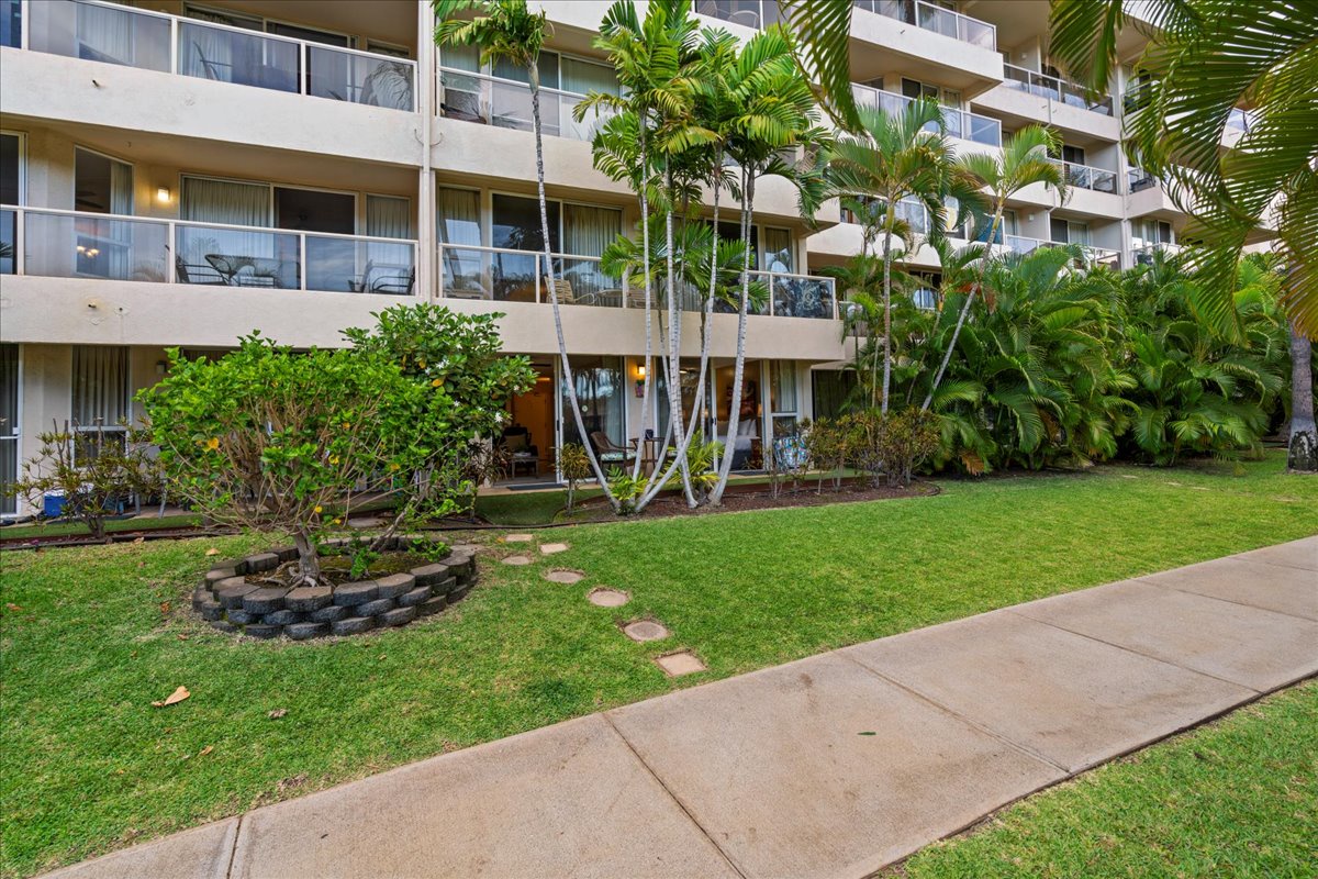 A stone path from the lanai invites easy sidewalk access