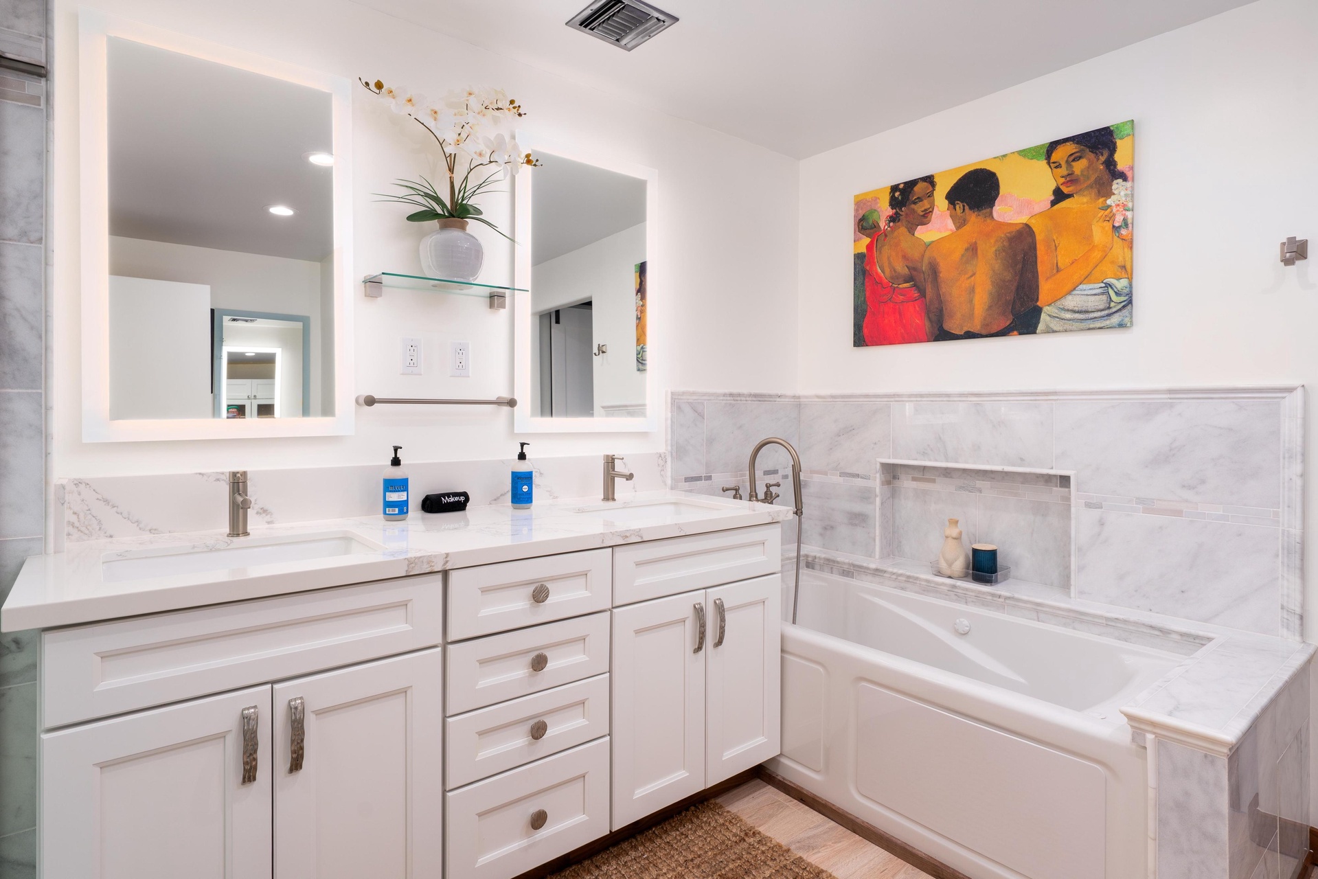 Soak your worries away in this elegant marble bathroom featuring a luxurious soaking tub and pristine double vanity.
