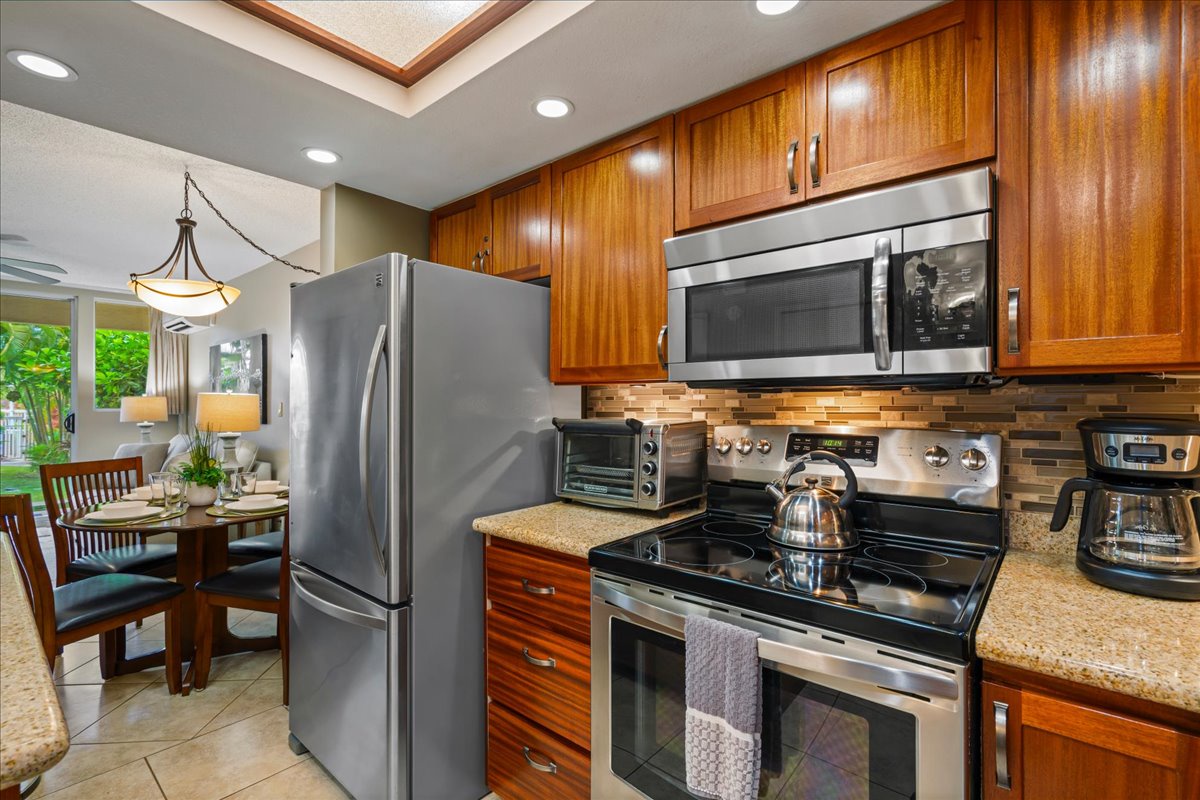 The fridge, microwave, and toaster oven make island living easy.