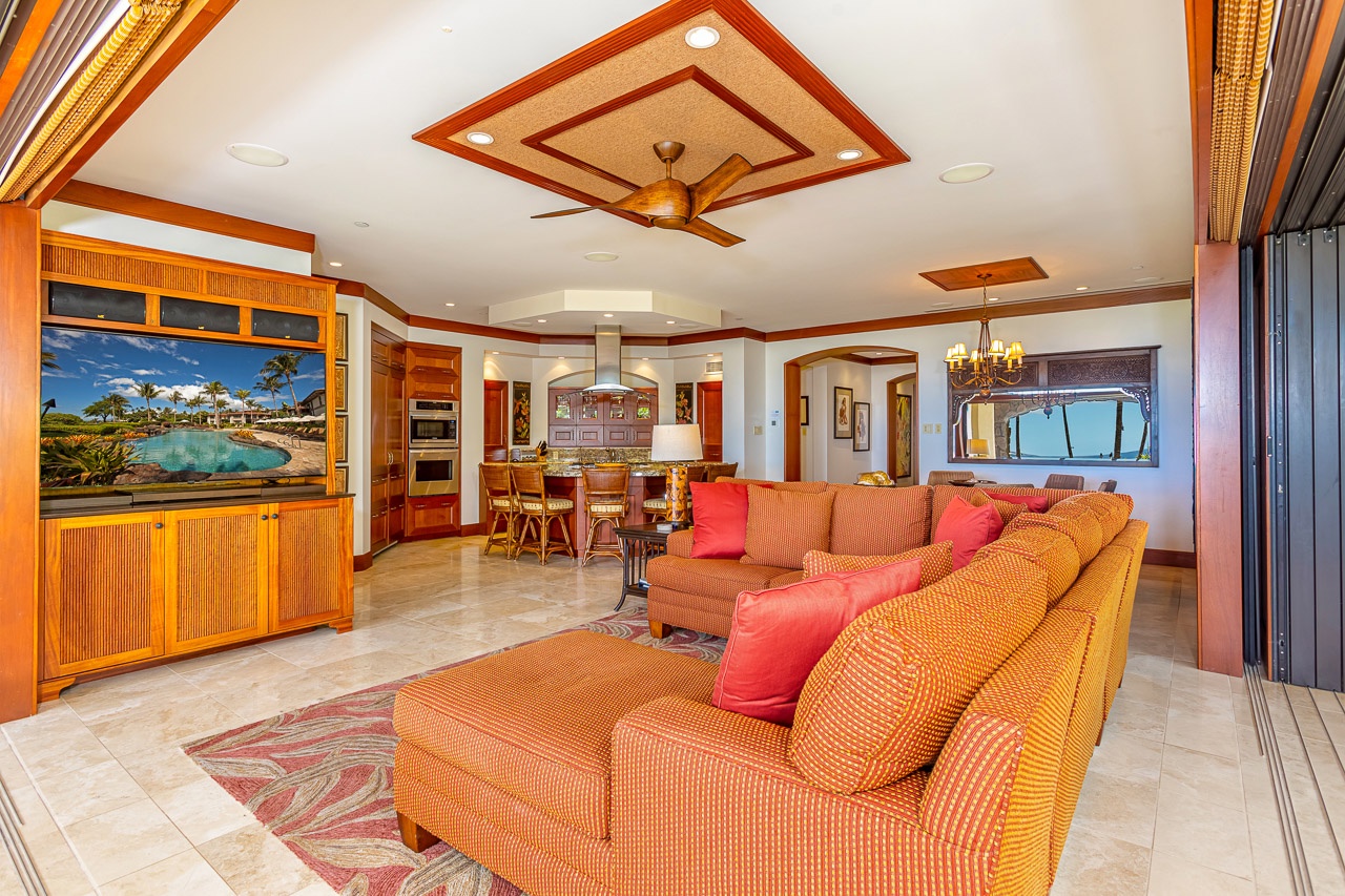 Step into your spacious tropical retreat where warm island tones and rich wood accents create an inviting atmosphere. Relax on plush seating while ocean breezes flow through, connecting you to paradise just outside your door.