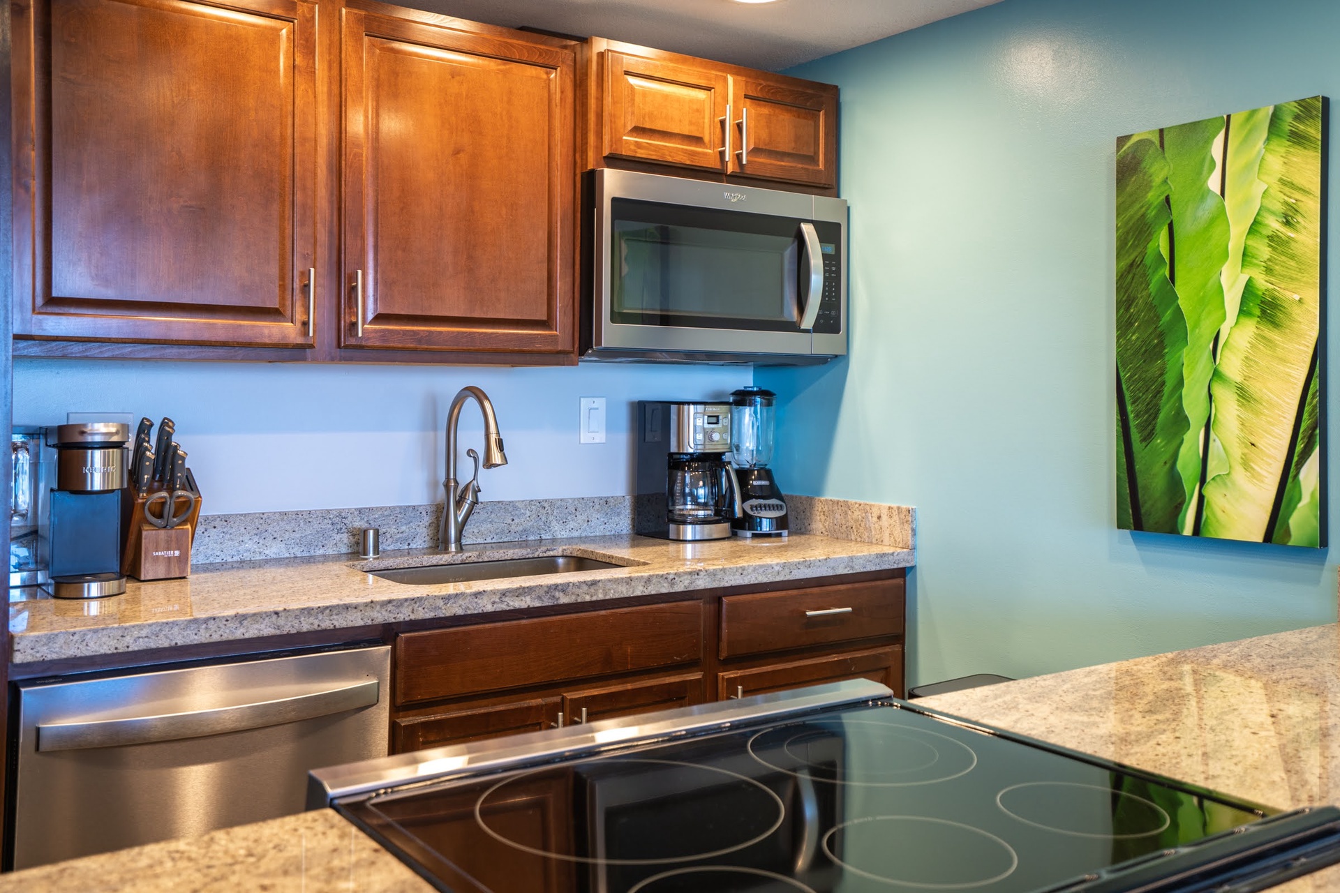 Whip up your favorite dishes in a fully equipped kitchen with modern stainless steel appliances and granite countertops, ready to serve all your vacation cooking needs.