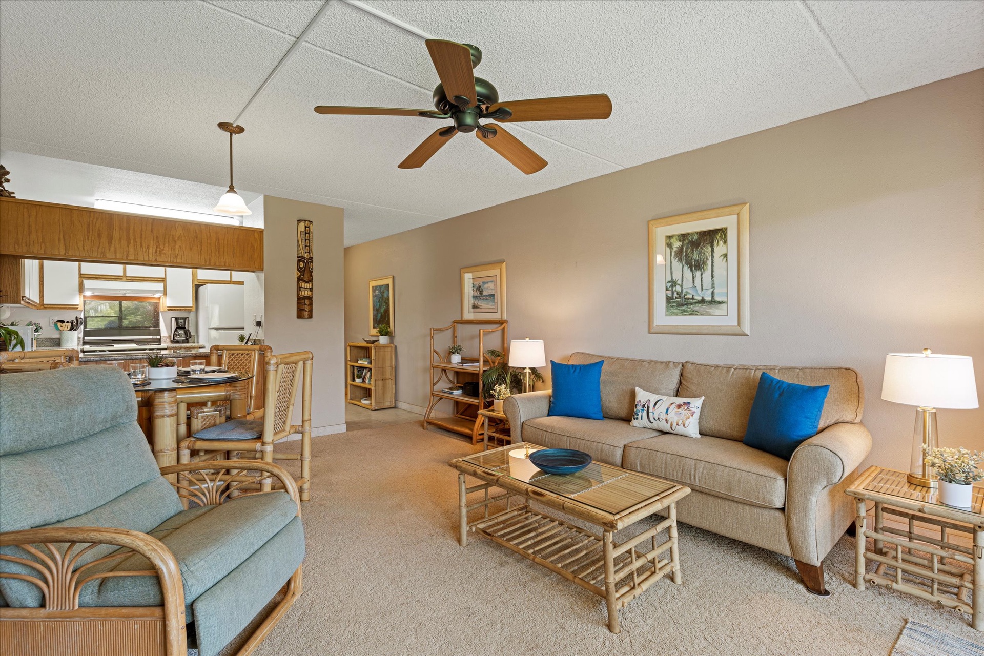 Unwind in your spacious living area, complete with tropical charm and coastal decor. The open layout flows into a fully equipped kitchen, perfect for preparing meals together.