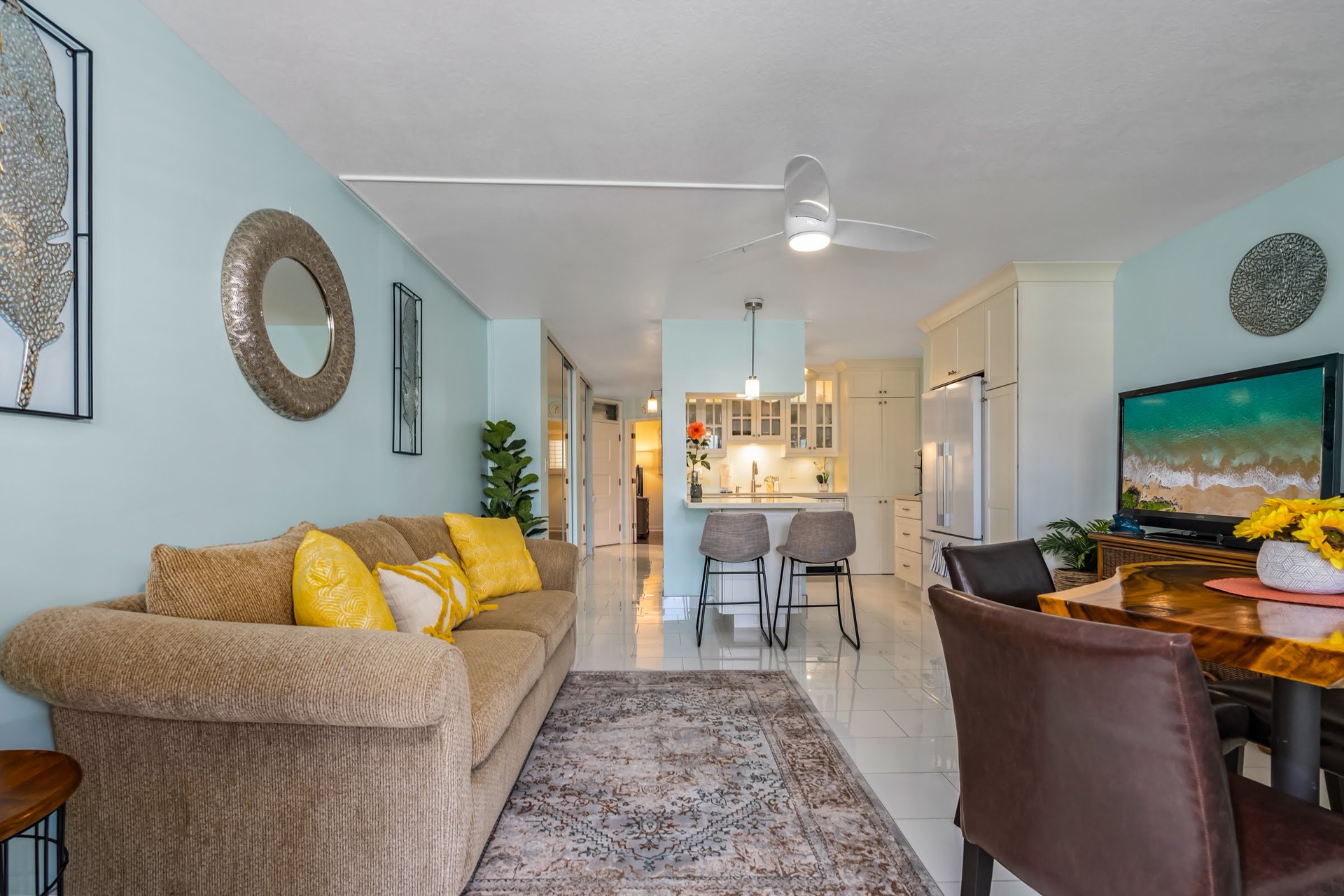 Step into your bright, open retreat with soothing coastal colors and modern comfort. Plush seating invites you to unwind while the fully equipped kitchen awaits your culinary creativity.
