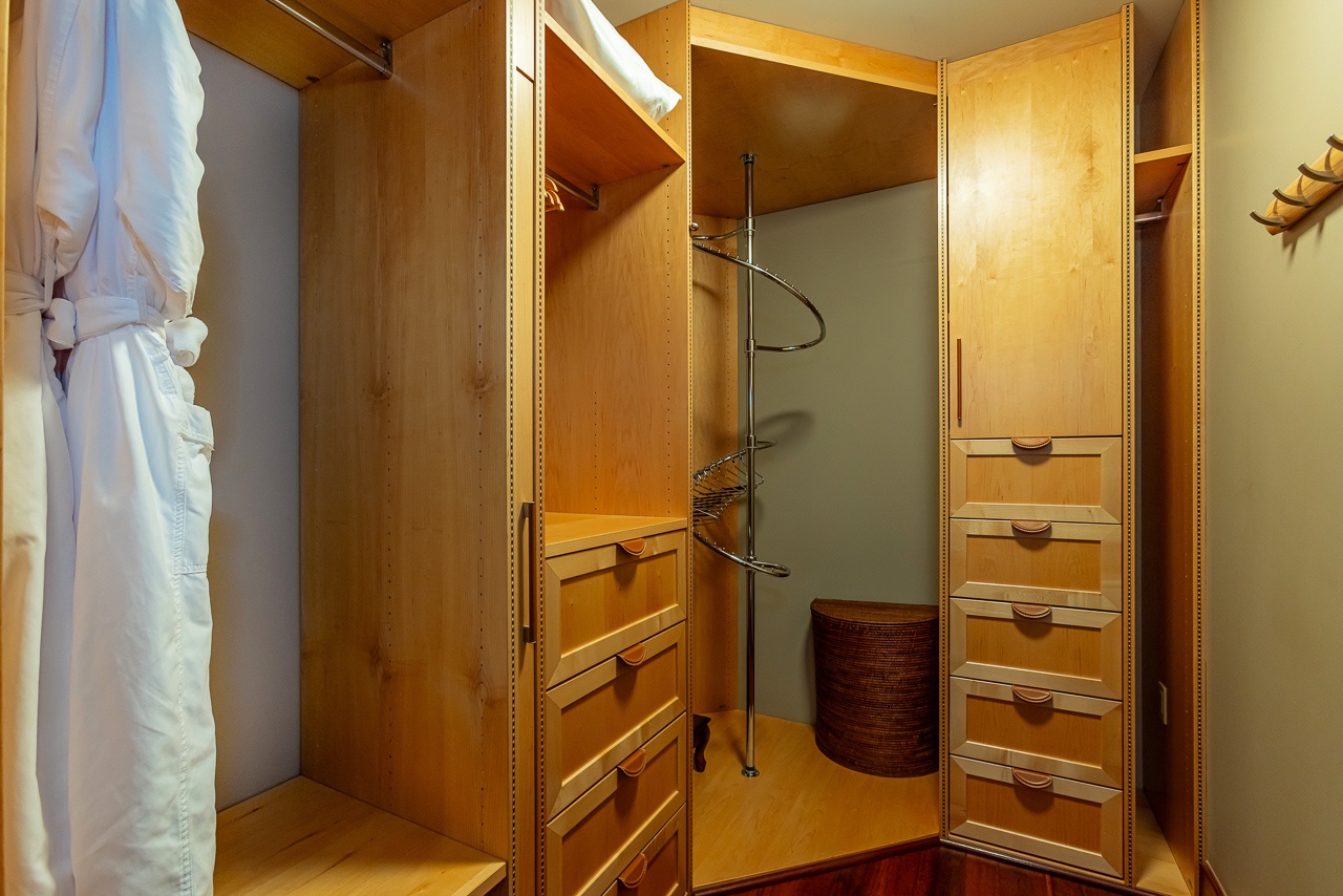 Your wardrobe with built-in drawers, shelves, and a robe waiting for your arrival—everything in its place so you can settle right in.