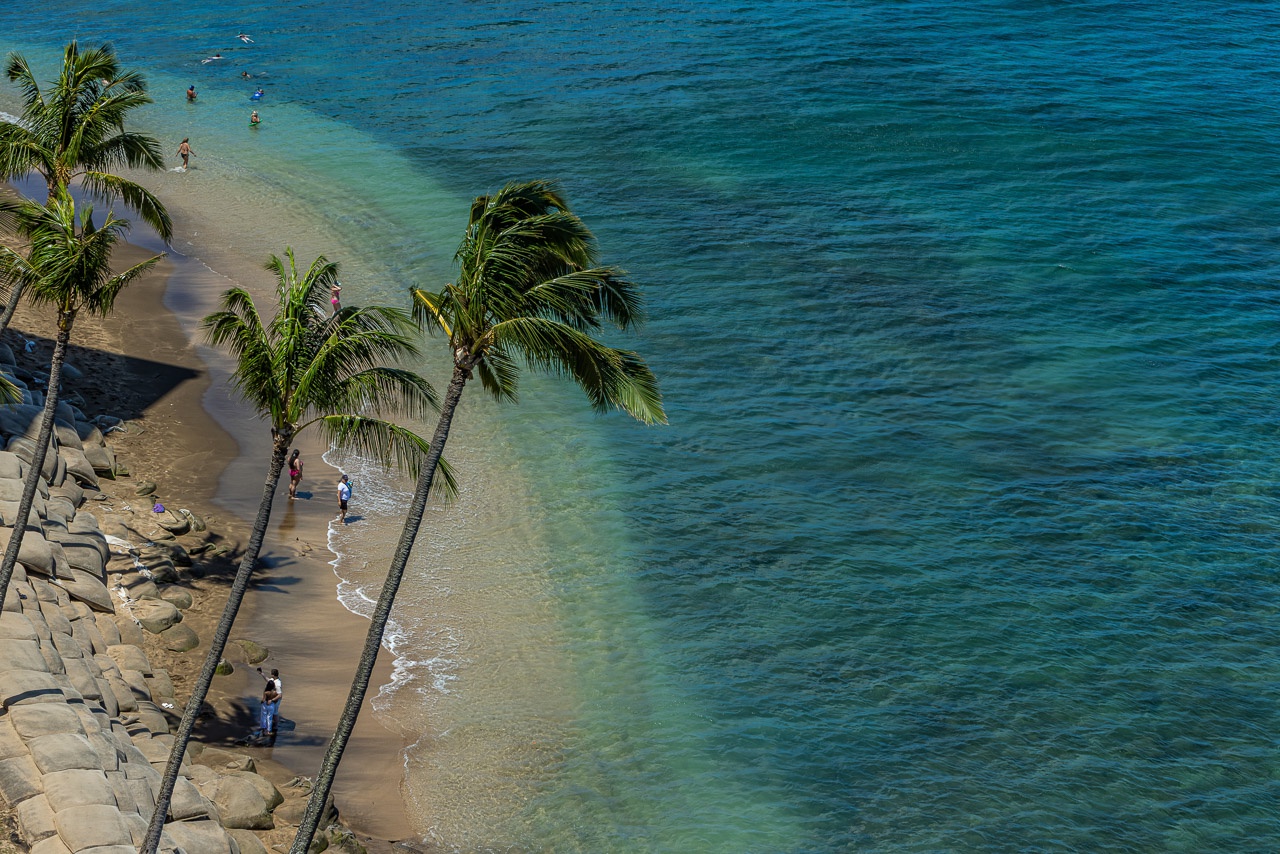 Steps away from crystal-clear turquoise waters and swaying palms.
