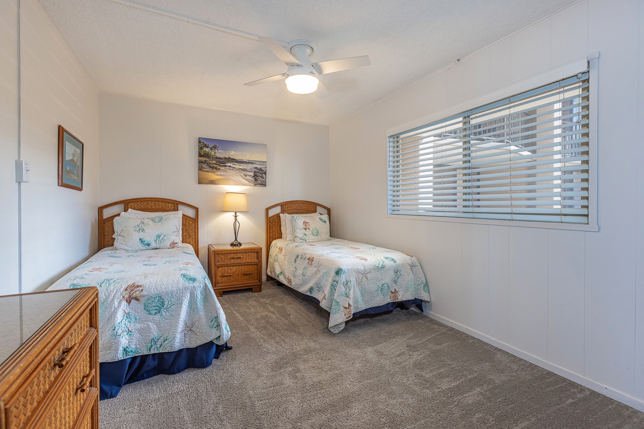 Twin beds with calming textures for a peaceful stay