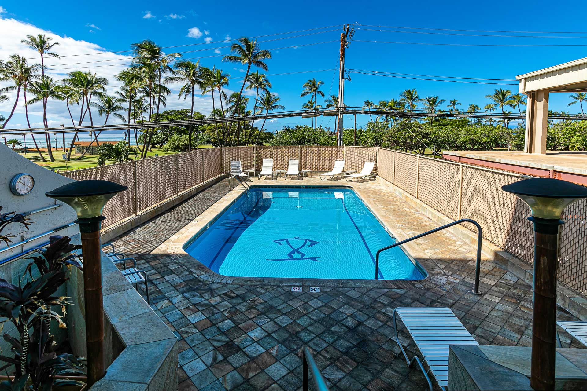 Unwind by the pool surrounded by Maui sunshine and palms