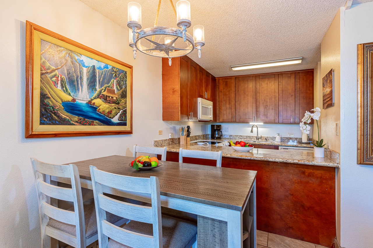 Gather for meals in your bright dining area, connected to a well-equipped kitchen with granite counters and warm wood cabinetry—perfect for preparing and sharing delicious moments together.