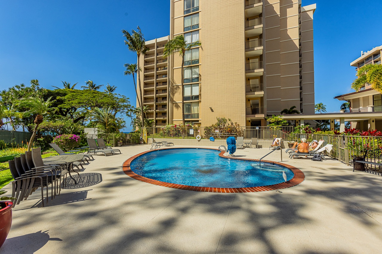 The property features a resort-style pool surrounded by lush tropical landscaping and ocean breezes. Step outside into the warm Hawaiian sunshine and make this your perfect island retreat.