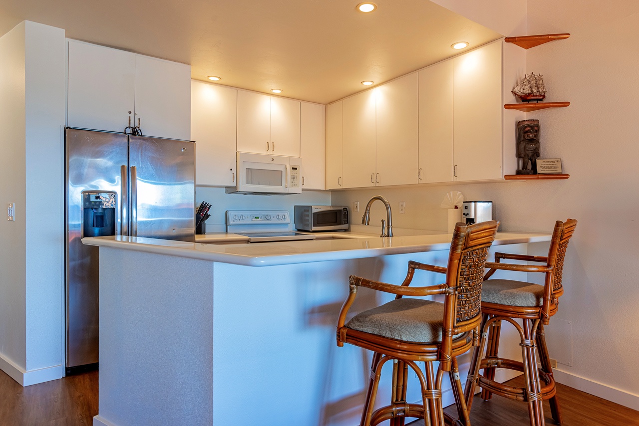 Step into your fully equipped kitchen where everything is ready for preparing meals together.