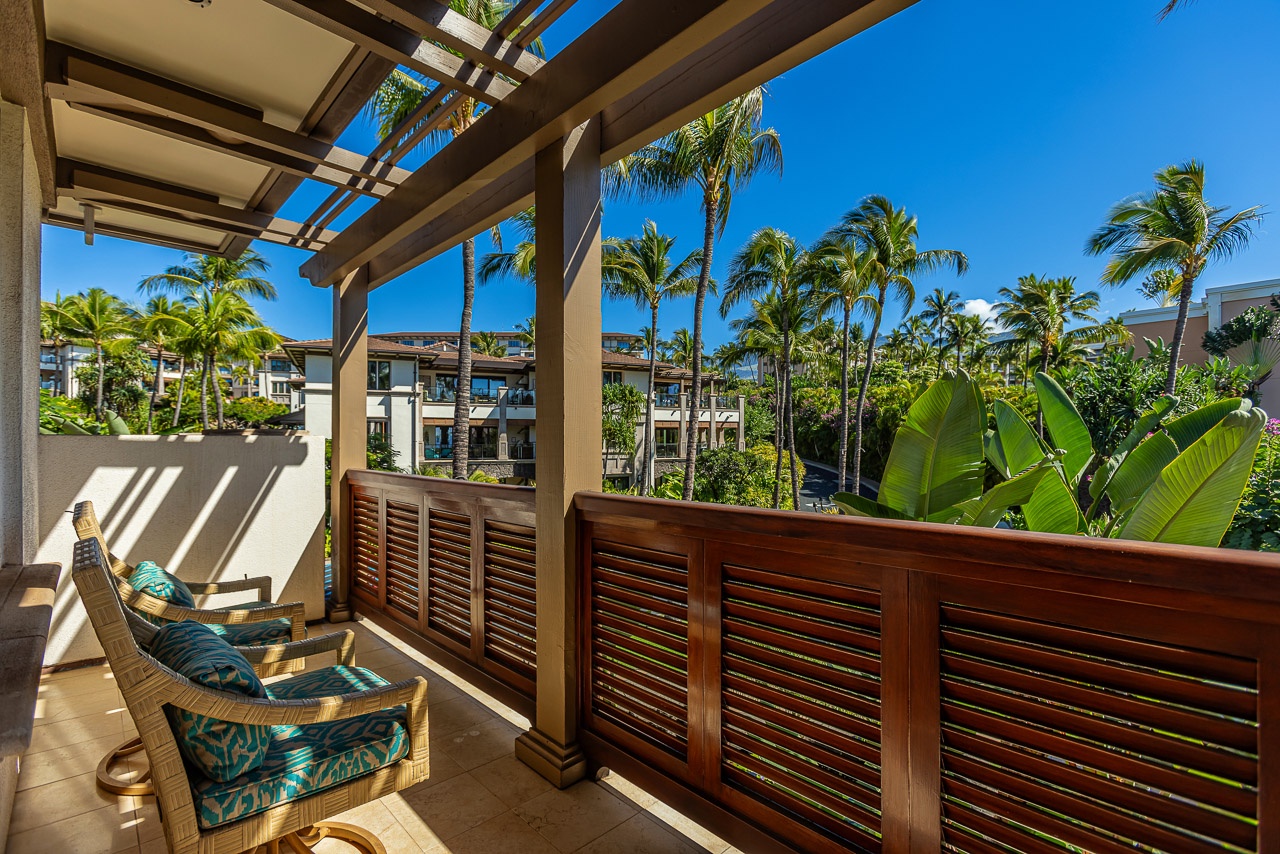 Soak in the sunshine and tropical breezes from your private balcony, where swaying palms and lush greenery frame your peaceful retreat.