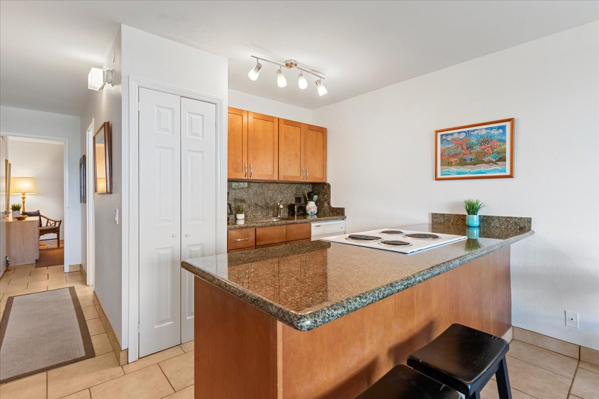 Your fully equipped kitchen features warm wood cabinetry, granite countertops, and everything you need to cook a memorable meal during your stay.