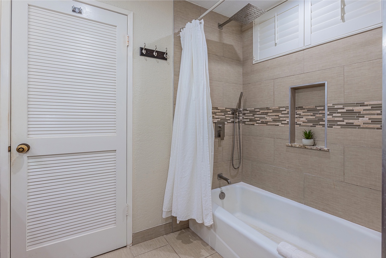 Modern guest bathroom with tub and shower combo