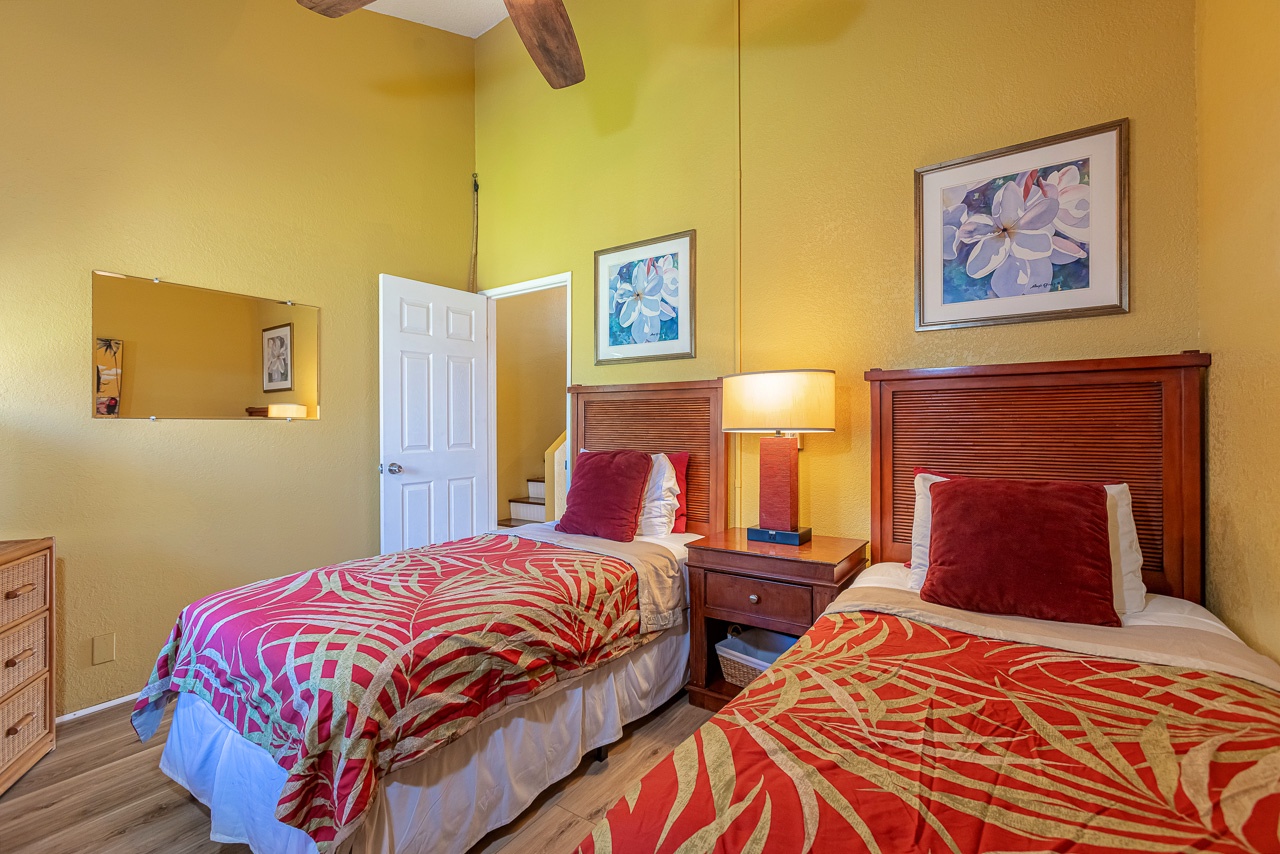 Bright downstairs room with tropical decor and comfortable essentials