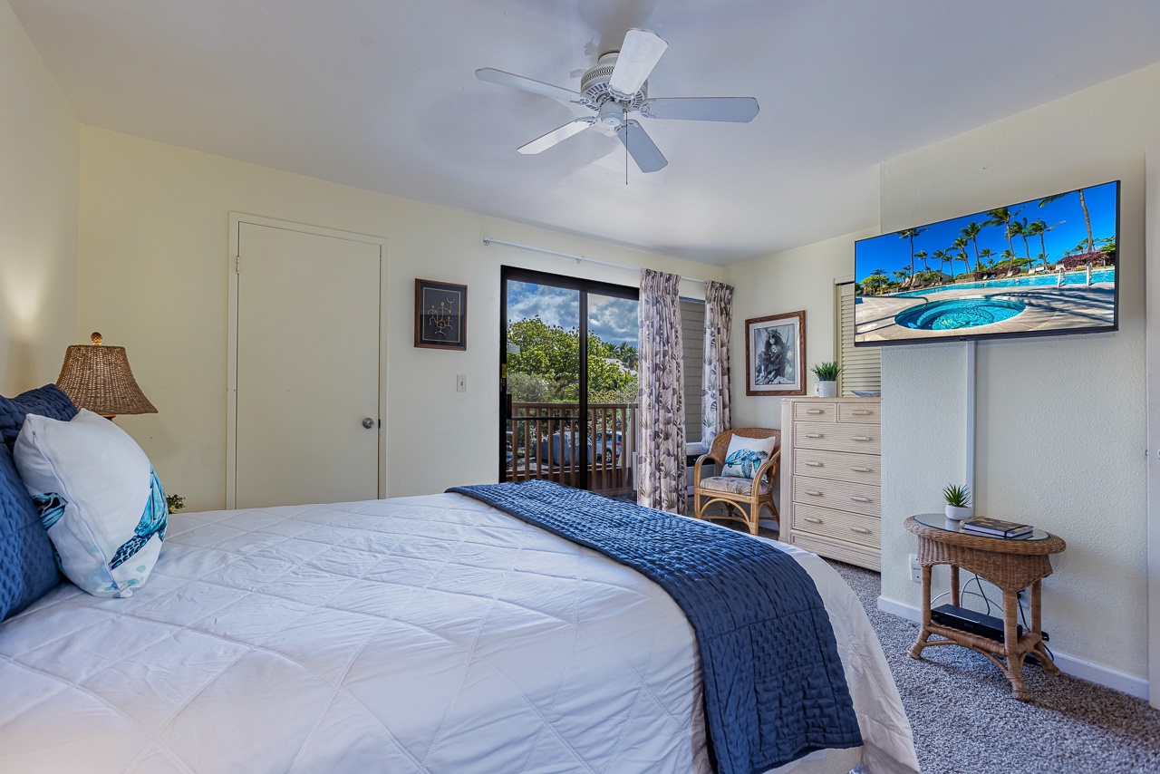 Sink into fresh linens and let the ceiling fan keep you cool while you take in garden views through your private balcony doors.