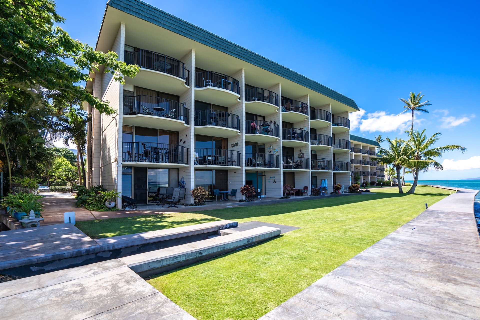 A tropical oceanfront retreat. Your private balcony awaits just steps from paradise.