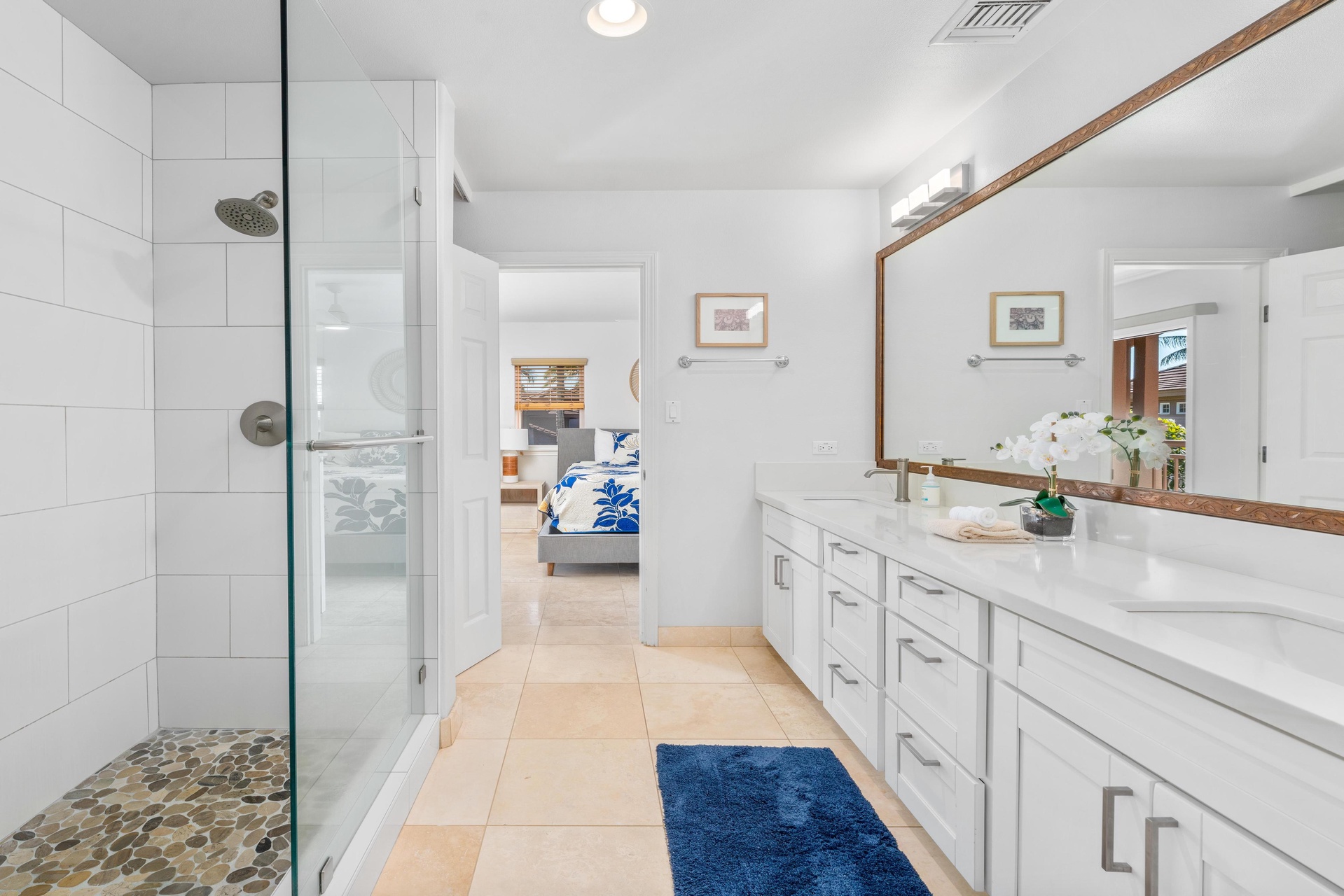 Unwind in your spa-like ensuite with rainfall shower, dual vanities, and calming white finishes that create a serene morning routine.