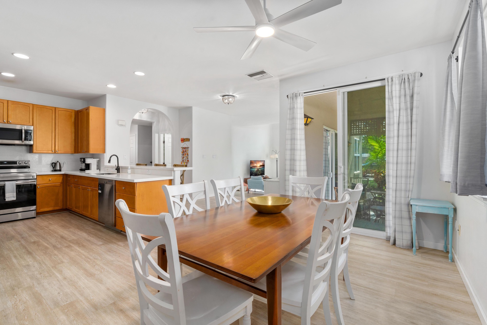 Your open-concept kitchen and dining space invites memorable meals together, with sleek appliances and bright, welcoming atmosphere.