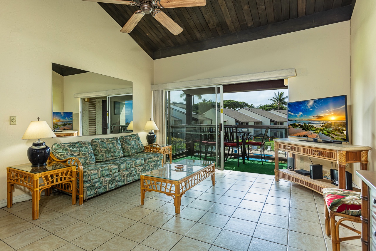 Bright living space flowing to the lanai and island scenery