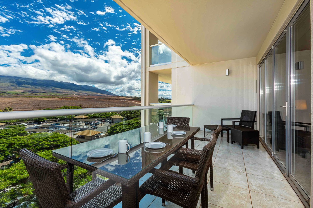 Sip your morning coffee or share an evening meal on this spacious lanai, where sweeping mountain vistas and island greenery create a stunning natural backdrop for your stay.