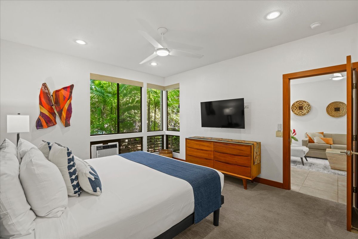 Relax in a bright primary bedroom designed for restful island nights