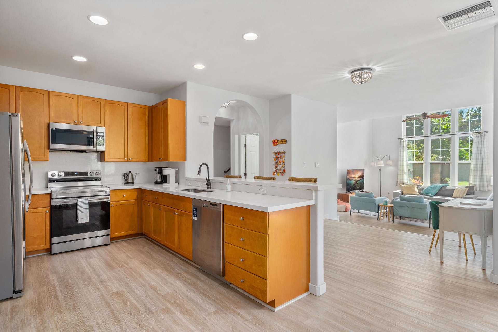 Your fully equipped kitchen flows seamlessly into the bright living space, perfect for cooking and entertaining together.
