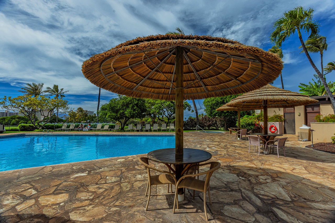 Unwind poolside beneath a thatched umbrella with tropical breezes and crystal-clear water just steps away.
