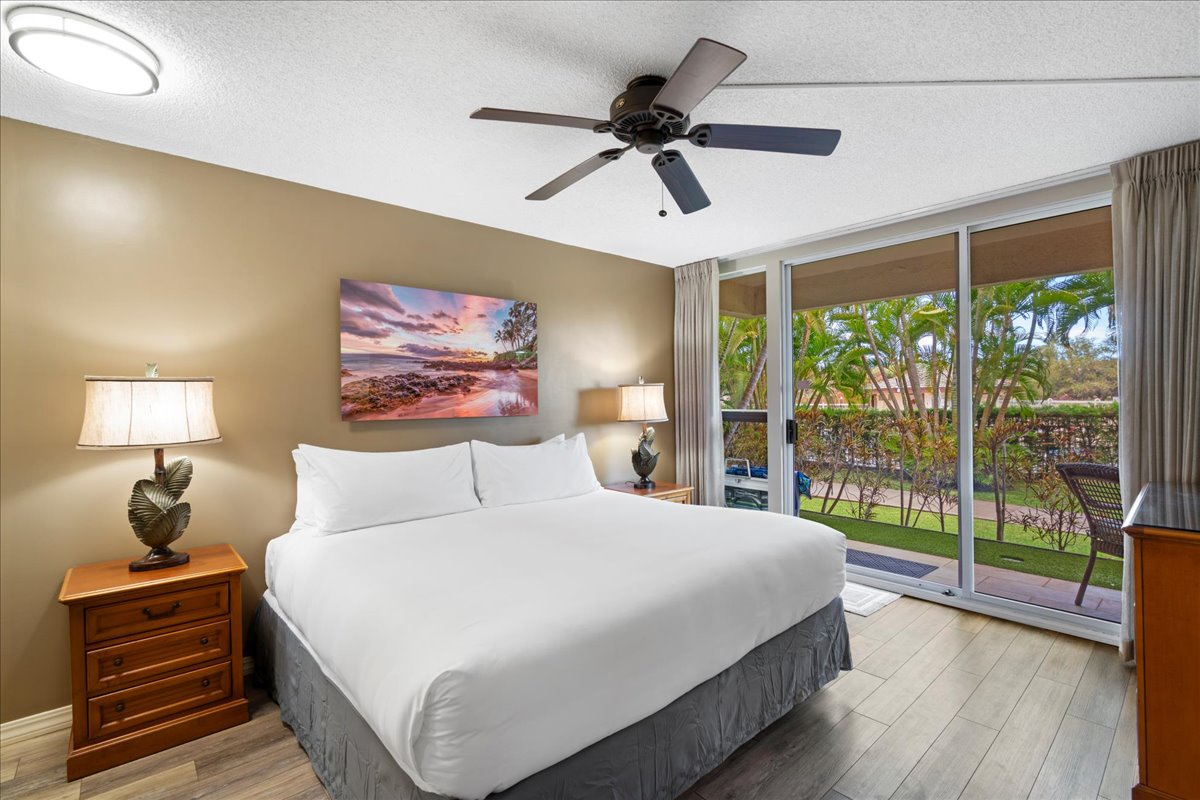 Rest easy in the spacious king bed with sliding doors to private lanai