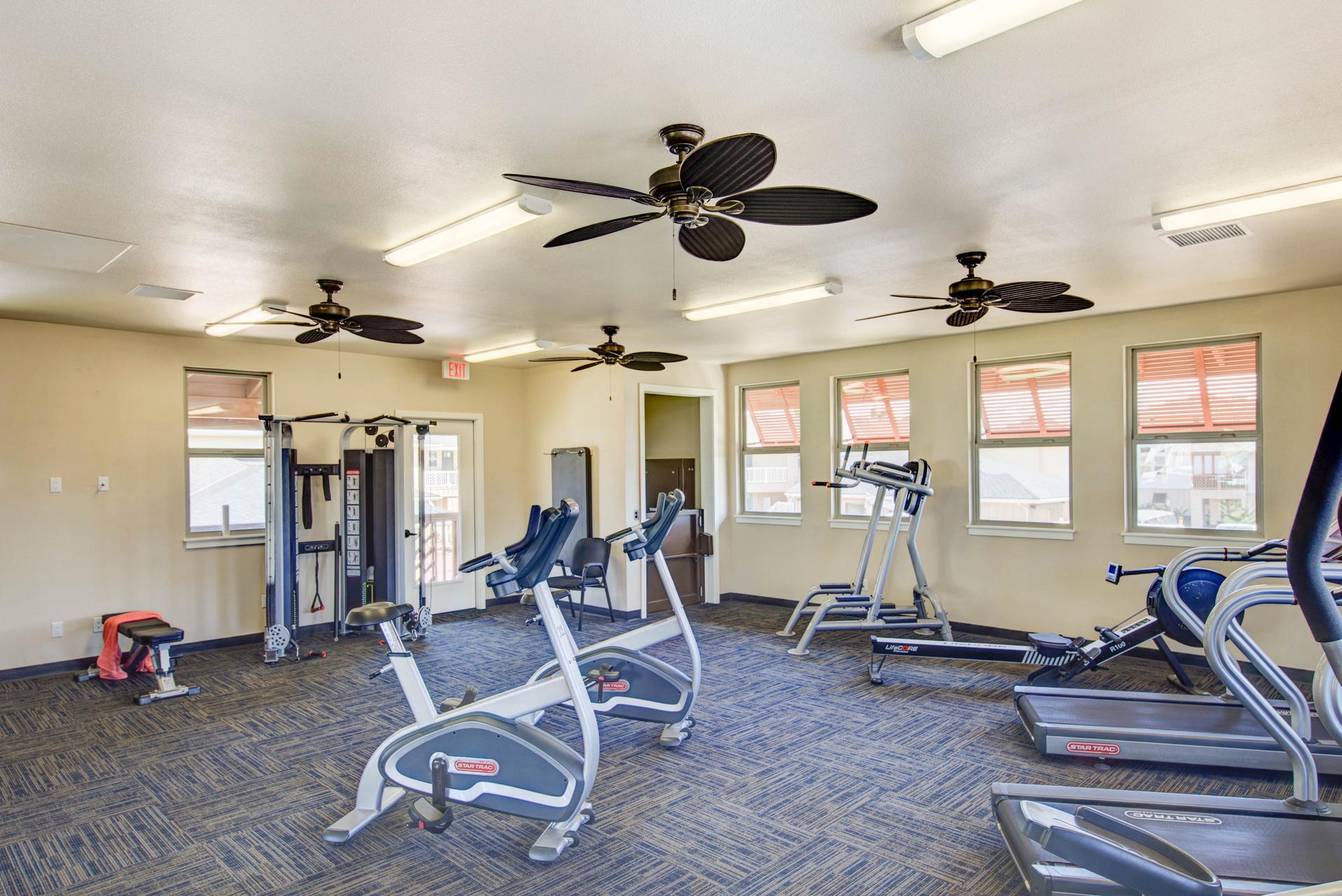 Stay active in your fully-equipped fitness center featuring cardio machines, strength equipment, and cooling ceiling fans.