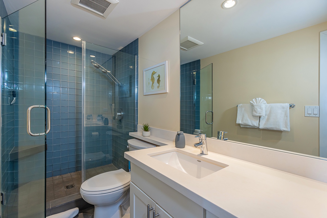 Primary bathroom with spacious vanity and walk-in shower