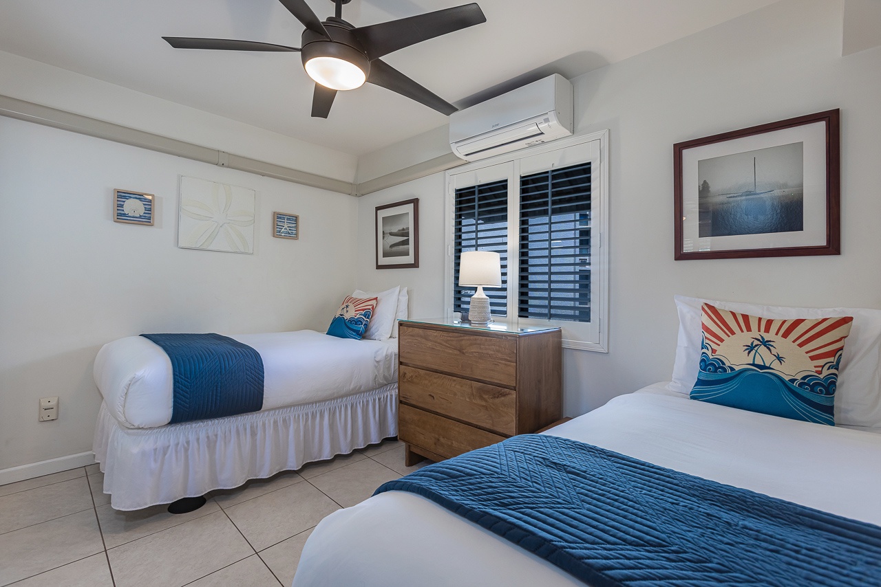 Drift off in your twin bedroom with crisp linens, tropical accents, and gentle ceiling fan breeze keeping you cool all night.