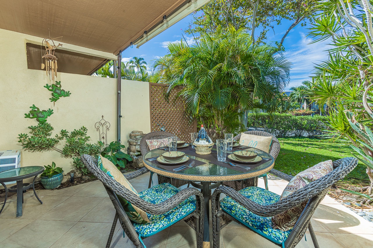 Your private lanai offers the perfect tropical dining spot with lush garden views and comfortable outdoor furniture.