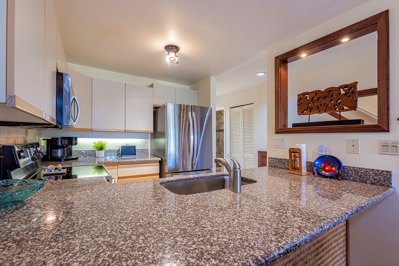 Your fully equipped kitchen features granite countertops, stainless steel appliances, and everything you need to prepare meals during your stay.