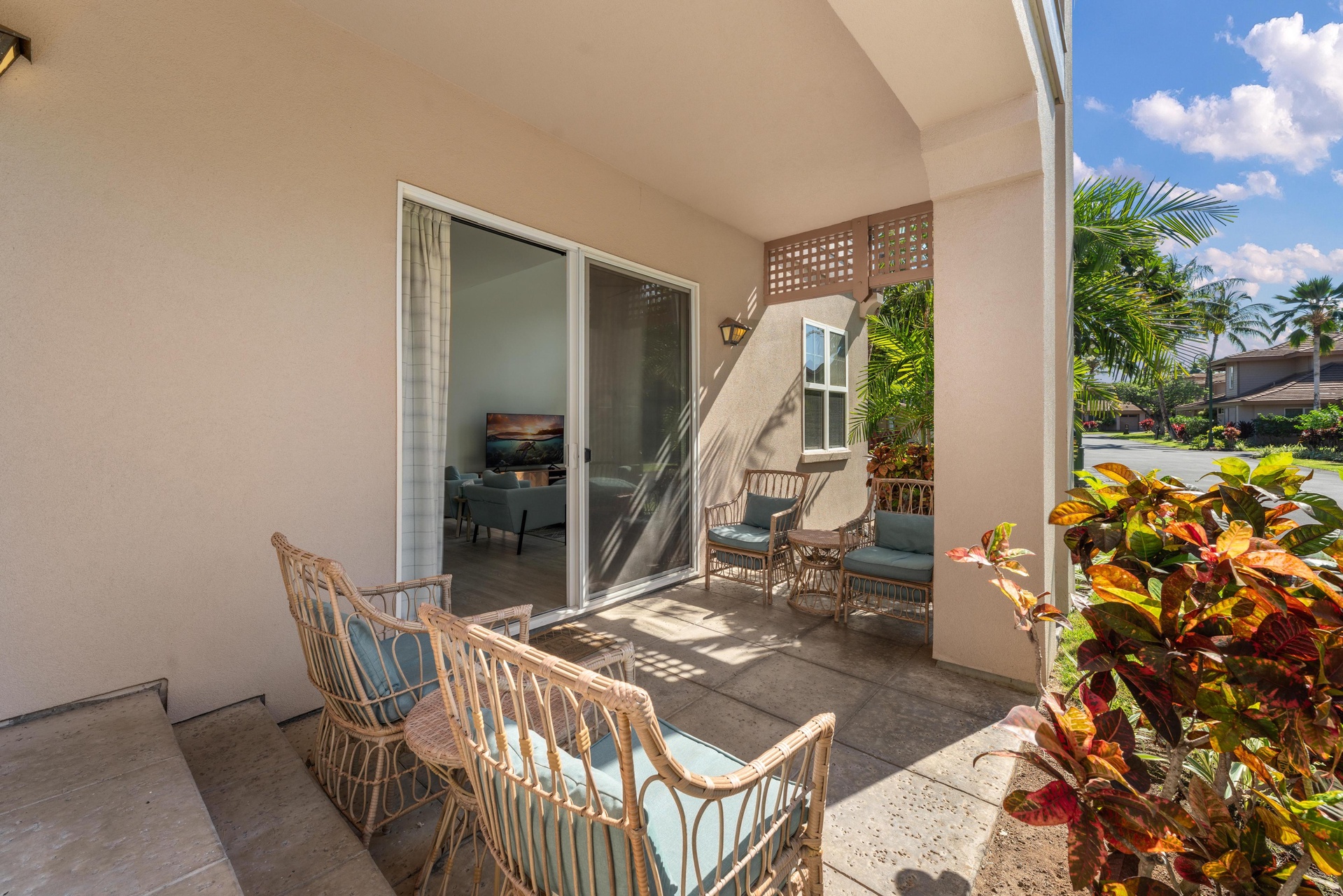 Step onto your private tropical terrace with wicker seating and lush garden views, where warm island breezes invite relaxation.