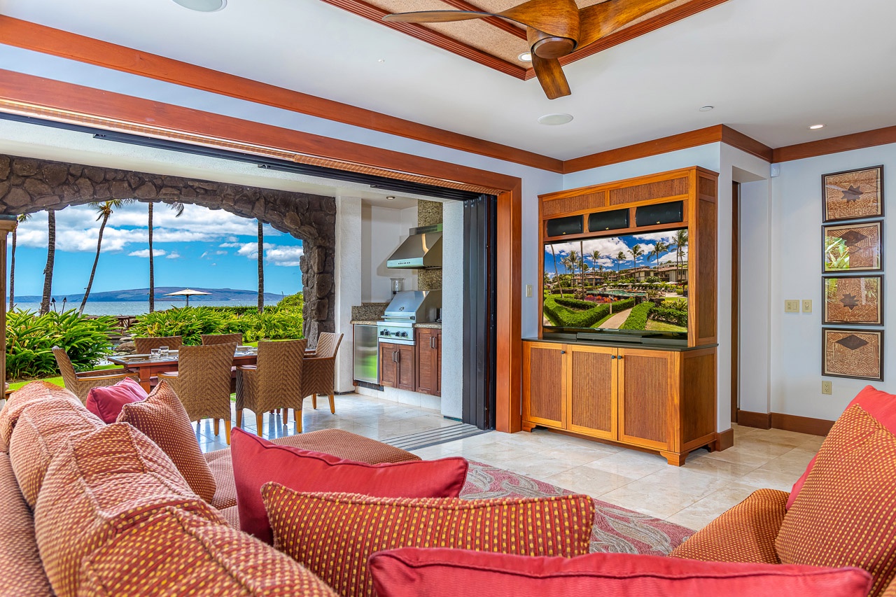 Sink into plush seating and soak in breathtaking ocean views that stretch to the horizon, just steps from your outdoor dining terrace.