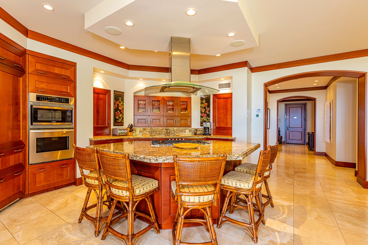 You'll love the chef's kitchen with its granite island, top-tier appliances, and elegant wood cabinetry—perfect for preparing meals together while you soak in the warmth of the space.