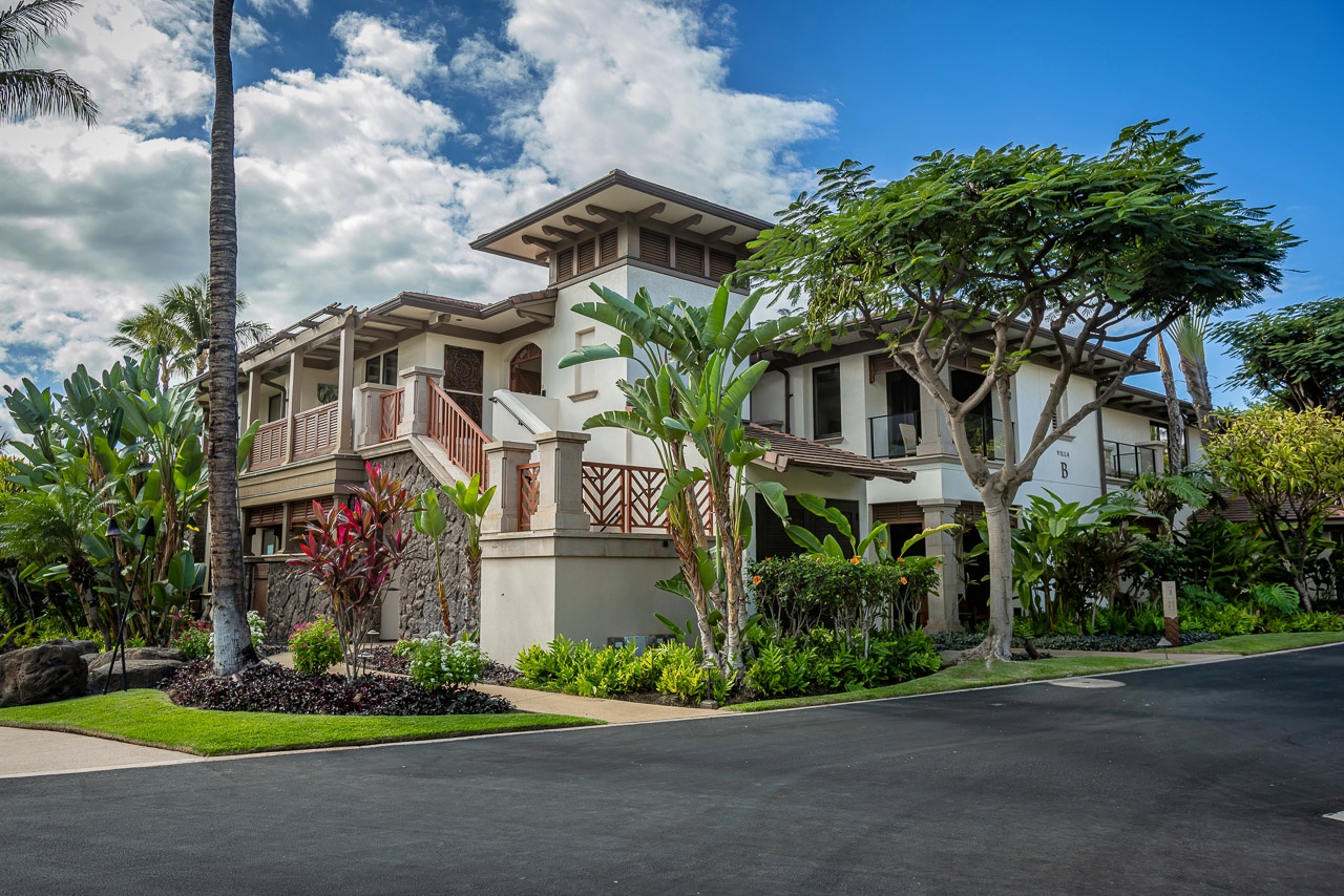 This elegant Villa sits within a beautifully landscaped tropical setting, featuring lush gardens, palm trees, and native foliage that frame the entrance to your island retreat.