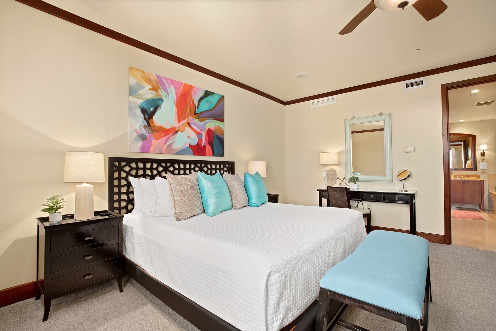 Relax in your stylish bedroom featuring plush bedding, vibrant art, and elegant touches for a peaceful retreat.